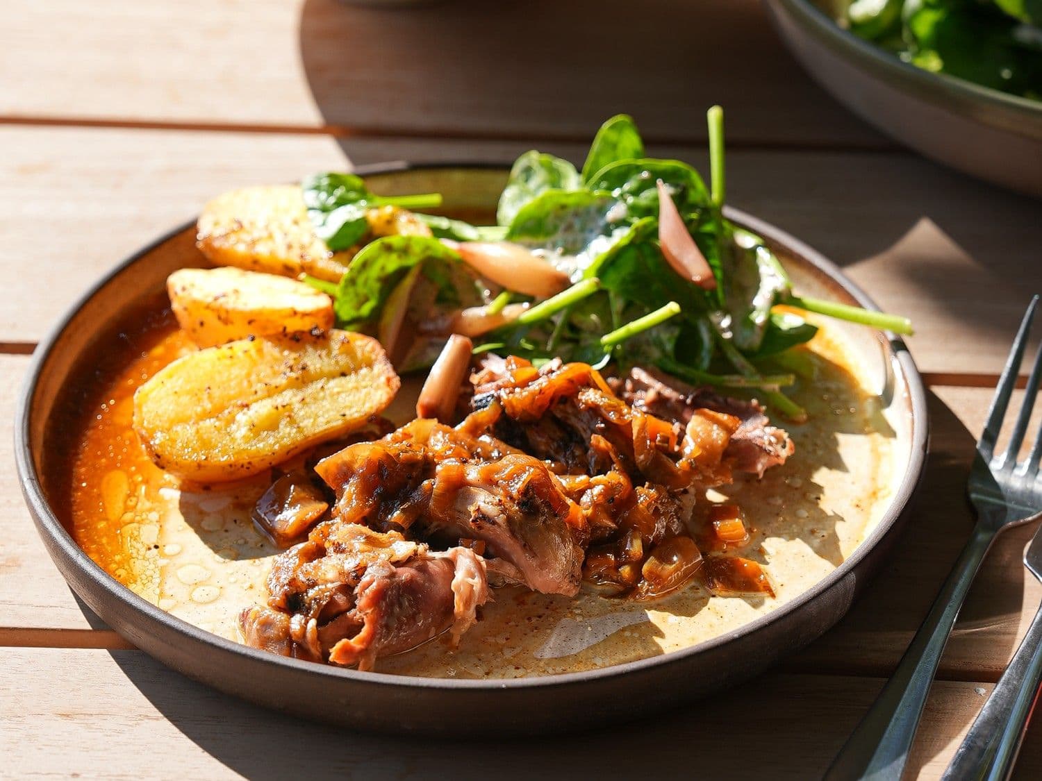 Lamsschouder met spinazie en truffelvinaigrette