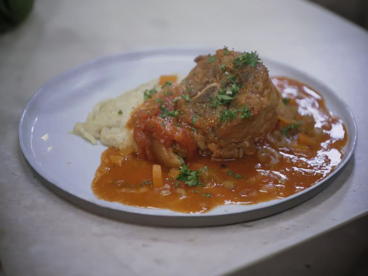 Ossobuco van varkensvlees met polenta