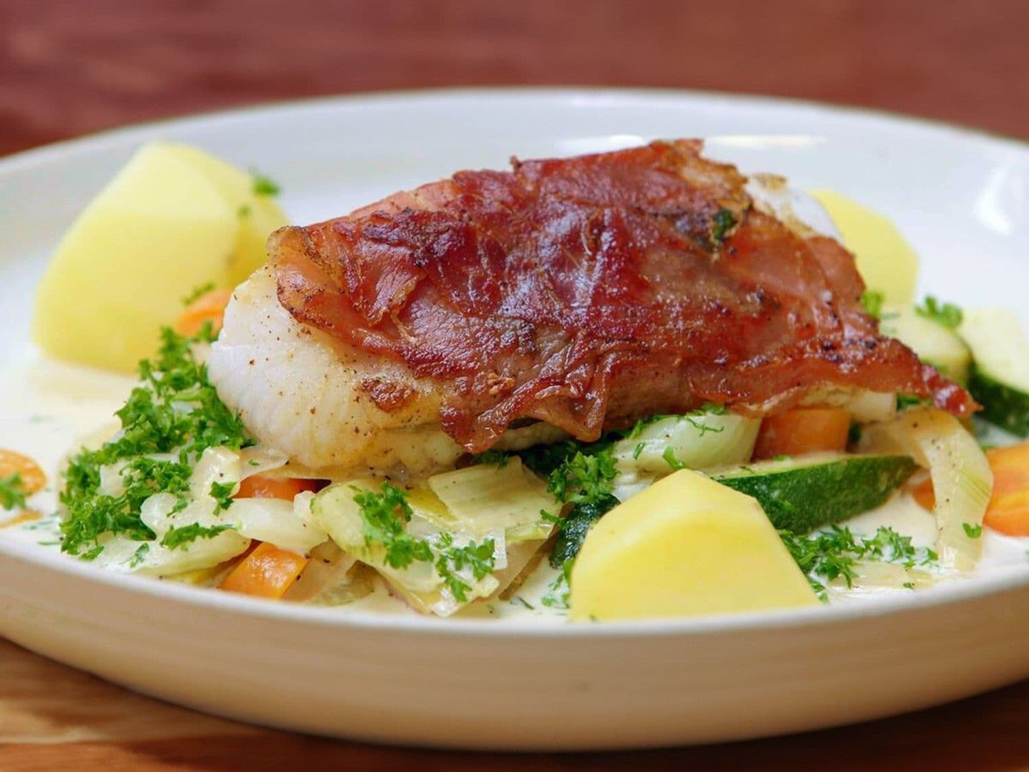 Saltimbocca van schelvis met gestoofde groentjes