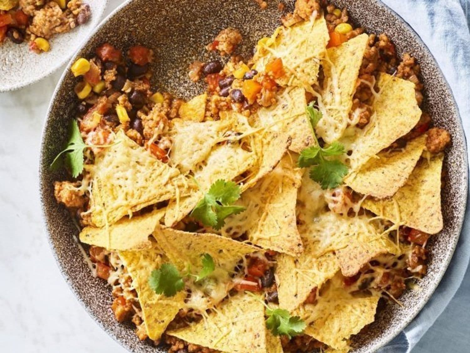 Ovenschotel van chili con carne met nacho's en kaas